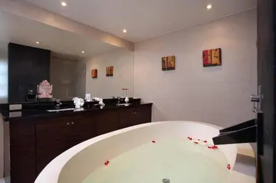 a large bathroom with a large bath tub with a sink at The Residence Villa 203 in Bang Tao Beach