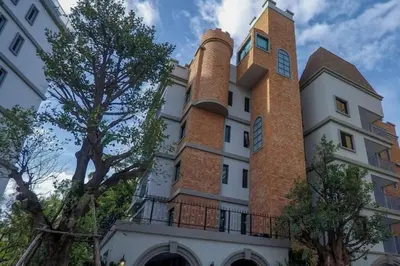 a building with a tall tower on top of it at 2 Bedroom Apartment in Naiyang - The Title Residences, Naiyang in Nai Yang Beach