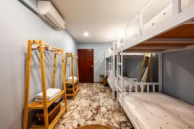 a room with two bunk beds and a hallway at Kinnaree Grand Villa - pool, panoramic views, maid in Kamala Beach