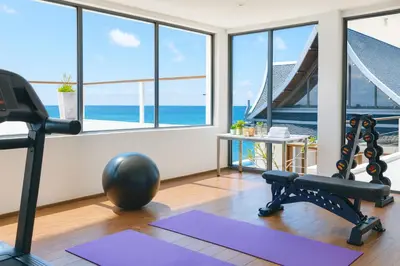 a gym with a view of the ocean at Villa Nevaeh - Ocean Front Private Villa Kamala Beach in Phuket Town