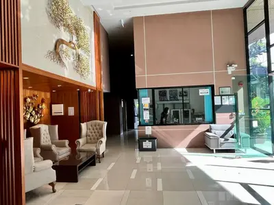a lobby with couches and chairs in a store at Aristo Resort Surin Beach M18 in Phuket Town