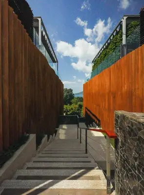 a walkway between at Bluepoint SeaView Retreat Patong in Patong Beach