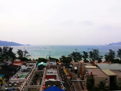 a view of a city with the ocean in the background at Patong Tower by United 21 Thailand in Patong Beach
