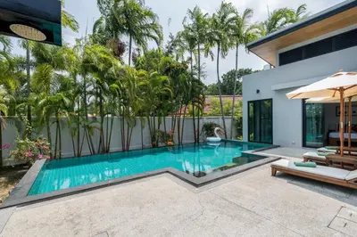 a swimming pool in the backyard of a house at Ban Bua Lux x MonthStayz Thailand in Rawai Beach