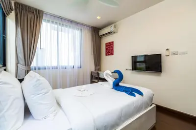 a bedroom with a bed with a blue dinosaur on it at Phuket villa in Laguna Park in Bang Tao Beach