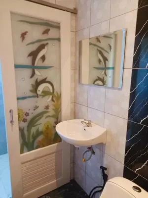 a bathroom with a sink and a toilet at Malai Maikhao Near Beach in Ban Mai Salae
