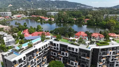 an aerial view of a building next to a river at 2 br Terrace Laguna, SkyPark in Thalang