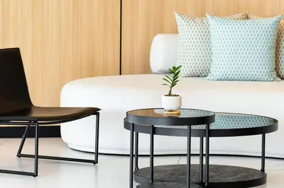 a living room with two tables and a couch at Sole Mio Boutique Hotel and Wellness - Adults Only in Bang Tao Beach