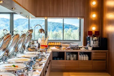a buffet line with plates of food in a kitchen at Sole Mio Boutique Hotel and Wellness - Adults Only in Bang Tao Beach