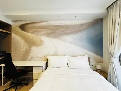 a bedroom with a bed and a desk at 1 Bdr Sky Park Golf view in Bang Tao Beach