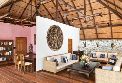 a living room with a couch and a table at Spacious apartment at Kata Ocean View M11 in Kata Beach