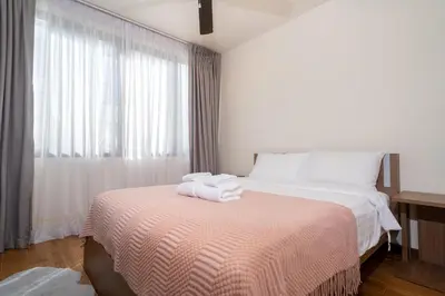 a bedroom with a bed with two towels on it at 3BDR Townhouse in Laguna Park in Bang Tao Beach