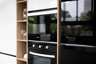 a kitchen with a black stove and a window at Villa Brianna Luxuria 4 - Rawai in Rawai Beach