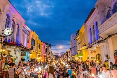 a crowd of people walking down a street at night at Villa Brianna Luxuria 4 - Rawai in Rawai Beach