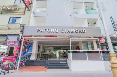 a building with a sign for a playing diamond store at Patong Diamond Hotel in Patong Beach