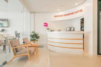 a store with chairs and a counter in a room at Patong Diamond Hotel in Patong Beach