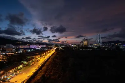 a view of a city at night with lights at Patong Diamond Hotel in Patong Beach