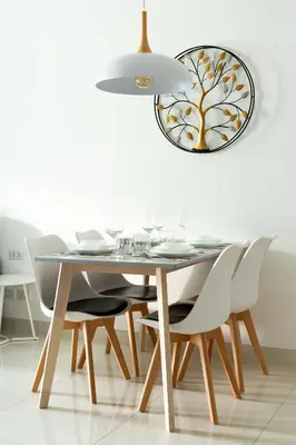 a dining room with a table and white chairs at Cassia 1 BR Sea View apt by NLA in Bang Tao Beach