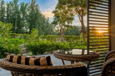 a patio with a table and chairs and a view at Cassia 2 BR Sea View&Terrace apt by NLA in Bang Tao Beach