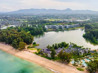 an aerial view of a resort on a beach at Cassia 2 BR Lake&Road View apt by NLA in Bang Tao Beach