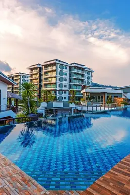 an image of a swimming pool with buildings in the background at Chalong Miracle Lakeview in Chalong