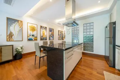 a kitchen with a large island with a counter top at Naithon beachfront apartment-pool gym restaurant in Nai Thon Beach