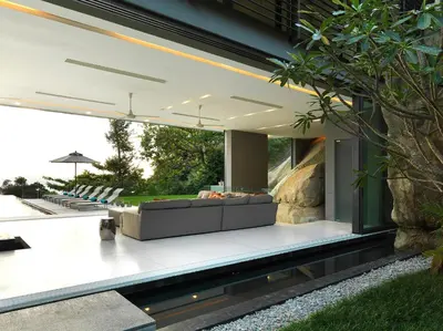 an outdoor living area of a house with a couch at Villa Amanzi Kamala by Elite Havens in Kamala Beach