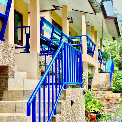 a group of blue stair risers on a house at Chamil House (ชามิล เฮ้าส์) in Ban Ko En