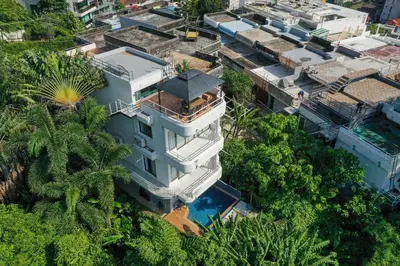 an aerial view of a house with a swimming pool at 5BR Jungle Seaview Villa Patong in Patong Beach