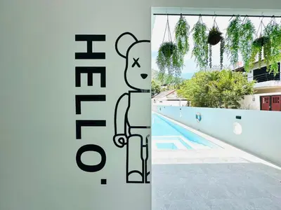 a drawing of a teddy bear next to a swimming pool at Kata Place Villa in Kata Beach