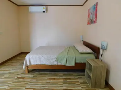 a bedroom with a bed in a room at Swiss Bonihouse Koh Yao Yai in Ban Phlu Nai