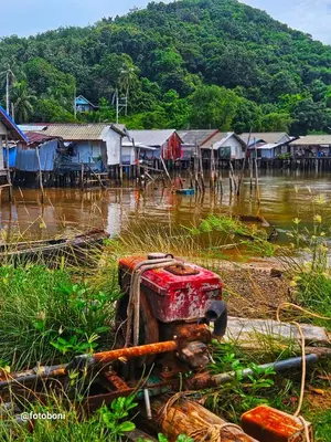a group of houses in a body of water at Swiss Bonihouse Koh Yao Yai in Ban Phlu Nai
