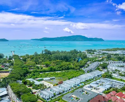 an aerial view of a city and the ocean at Andaman Sea Best Pool Access and Villas in Chalong