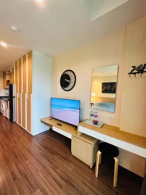 a room with a desk with a monitor and a mirror at Brand Naithon Condo C411 in Nai Thon Beach