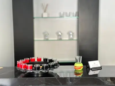 a counter with a stove with red and green cups at House 148 Patong Pool Villa 4BR Near Beach in Patong Beach