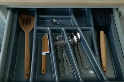 a tray filled with utensils in a drawer at Apartment near Central phuket in Phuket Town