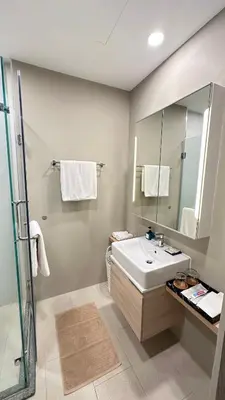 a bathroom with a sink and a mirror at Diamond Phuket Bang Tao in Bang Tao Beach