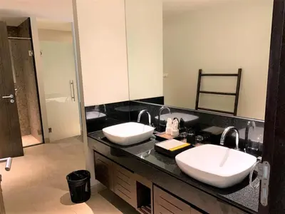 a bathroom with two sinks and a large mirror at Olive 1 Bedroom Beachfront in Rawai Beach