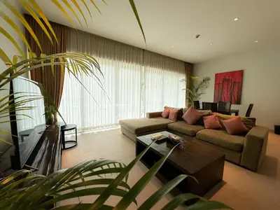 a living room with a couch and a table at Olive 1 Bedroom Beachfront in Rawai Beach