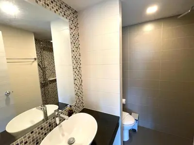 a bathroom with a sink and a toilet at Cozy studio Splendid Condo by Lofty in Kata Beach