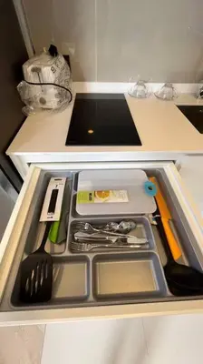 a drawer in a kitchen with utensils in it at Laguna Sky Park Corner 1 Bedroom in Bang Tao Beach