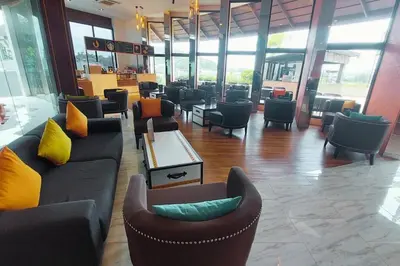 a lobby with couches and chairs in a building at Seaview Condo In 5 Star Resort MG1 in Phuket Town