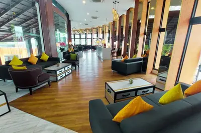 a lobby with couches and tables in a building at Seaview Condo In 5 Star Resort MG1 in Phuket Town