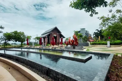 a fountain in a park with a building in the background at Seaview Condo In 5 Star Resort MG1 in Phuket Town