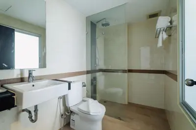 a bathroom with a toilet and a sink and a shower at Di Yana Patong in Patong Beach