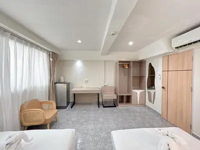 a hospital room with two beds and a table at Upsea patong in Patong Beach
