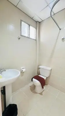 a bathroom with a toilet and a sink at Urban Patong Residence in Patong Beach