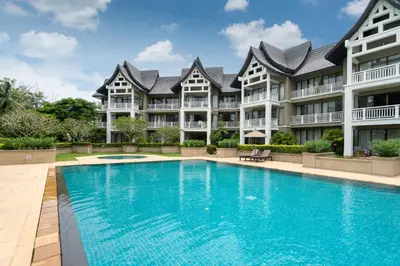 a large apartment building with a large swimming pool at Spacious 2BR Apartment ALM 2223 in Laguna, 10 min from BangTao Beach in Bang Tao Beach