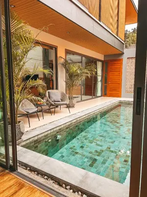 a swimming pool in the backyard of a house at Le Villa Residence in Phuket Town