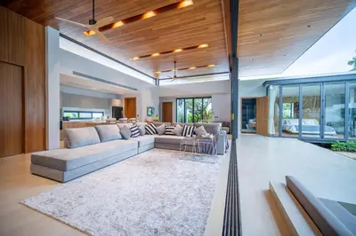 a living room with a couch and a table at Botanica Foresta 4BR Luxury Villa with Pool by NLA in Bang Tao Beach